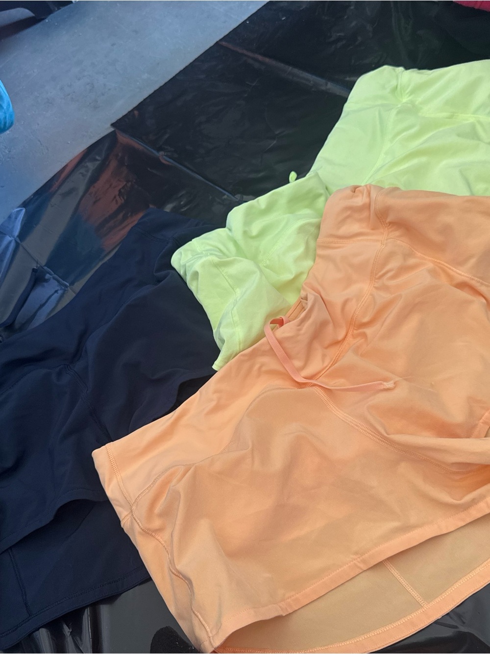 Three Activewear Tops in Neon Lime, Peach, and Navy